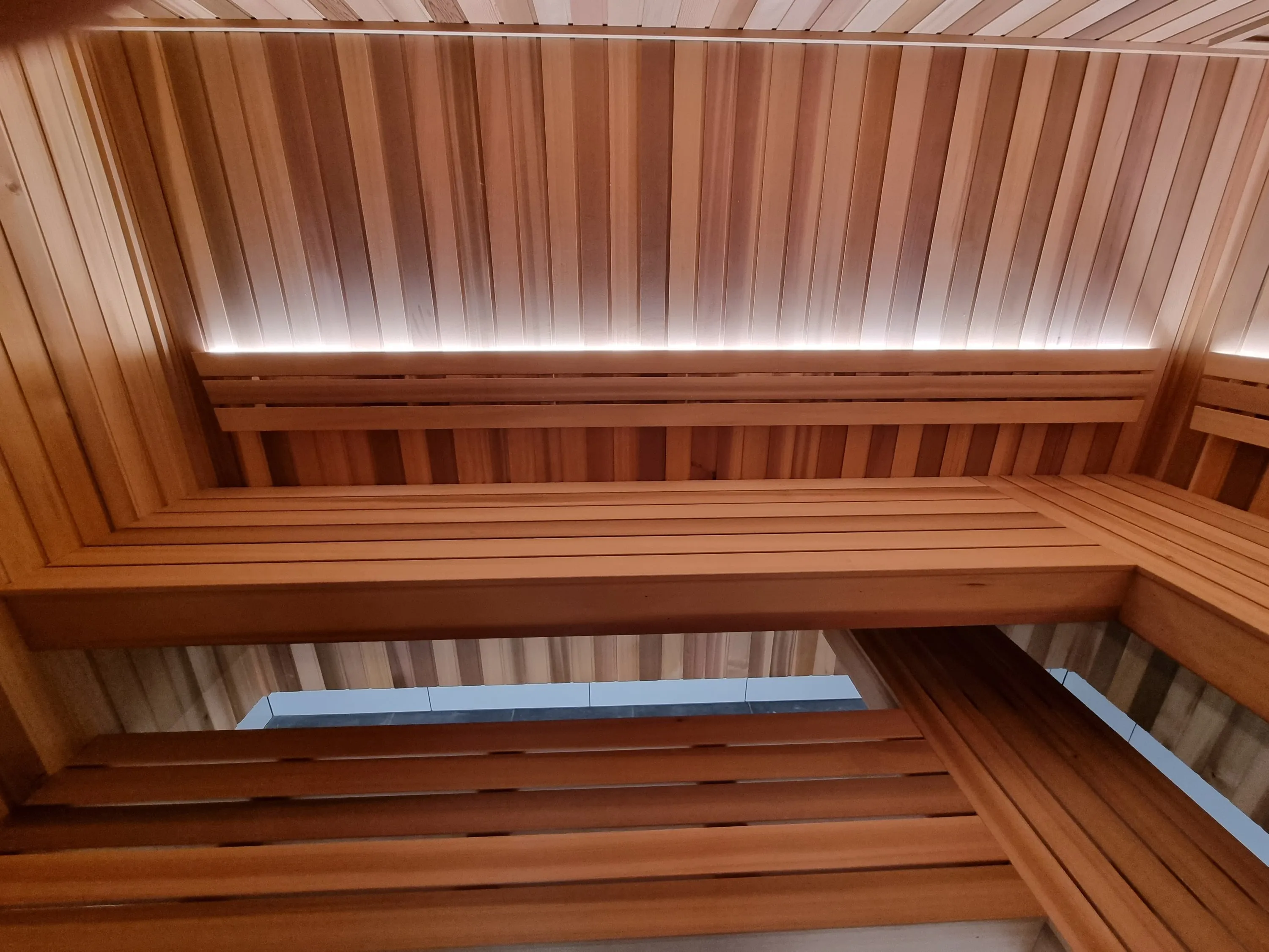 Upper and lower timber benches with a lit backrest