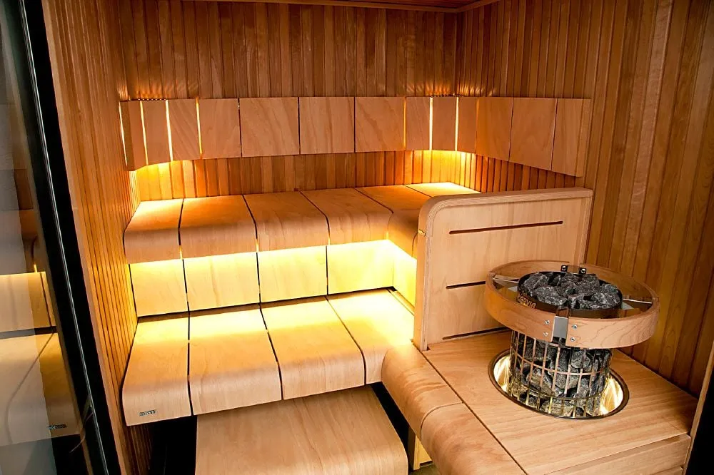 Harvia Cilindro heater installed in a sauna with Harvia Ventura benches