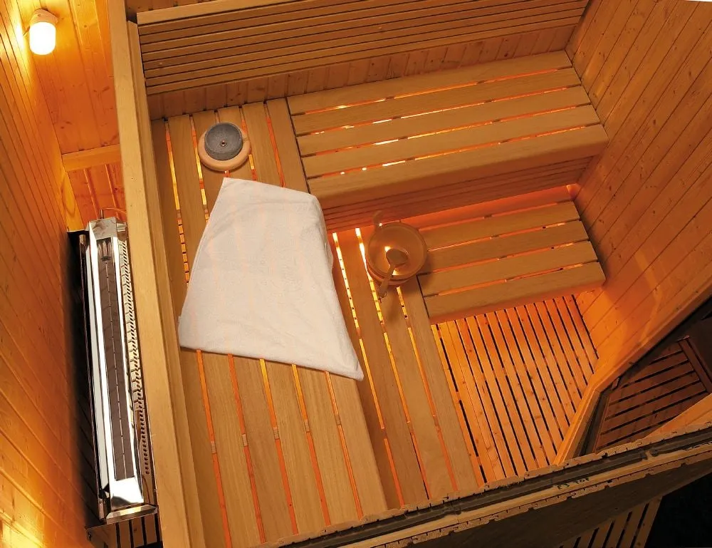 Harvia Hidden Heater installed behind sauna benches