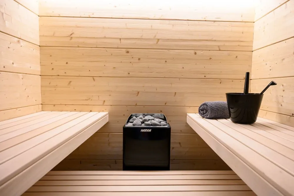 Black Harvia KIP heater installed in a sauna