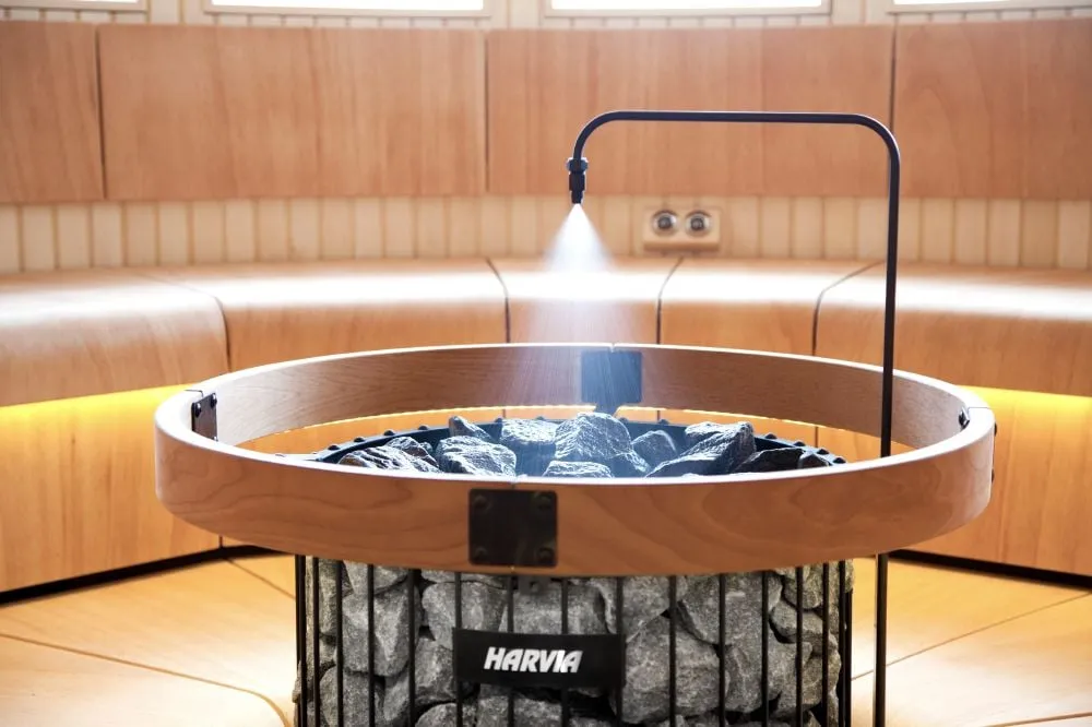 Harvia Legend Pro heater in a sauna with Harvia Ventura benches
