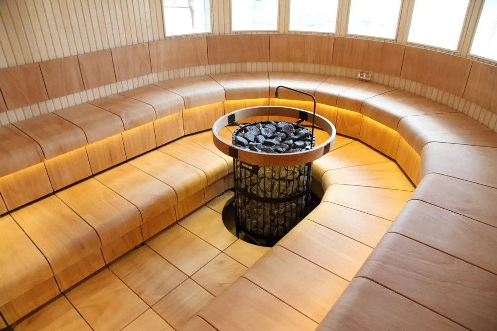 Harvia Legend Pro heater in a sauna with Harvia Ventura benches