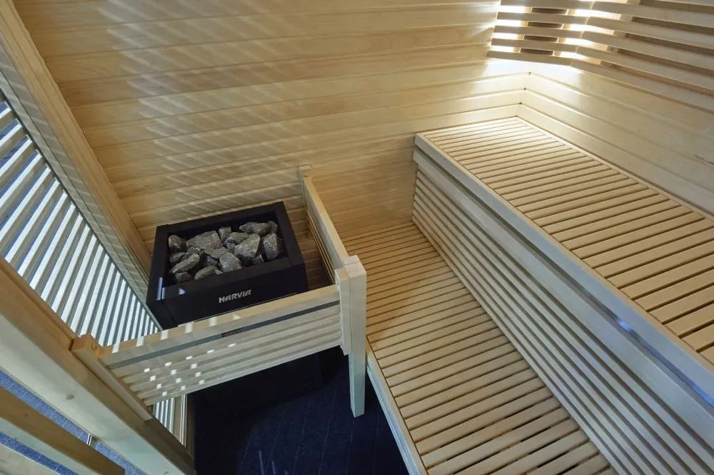 Harvia Virta heater in a sauna with Harvia Futura benches